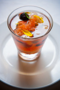 Sparkling wine Gelee with assorted berries, créme chantilly, grape fruit caviar, peach syrup and mint oil.